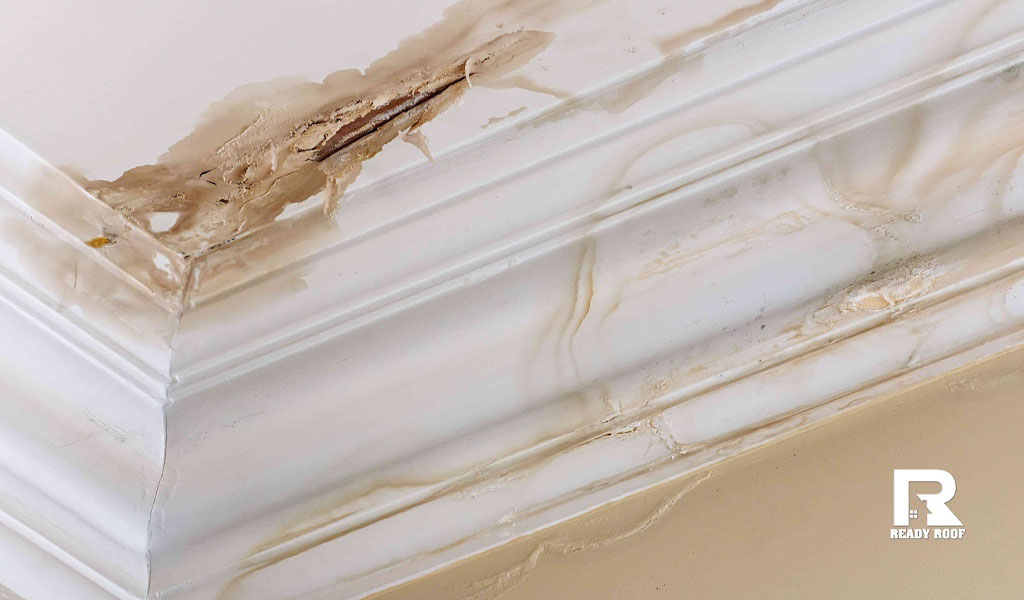 Interior ceiling water damage showing the urgent need to evaluate siding installation cost on long island.